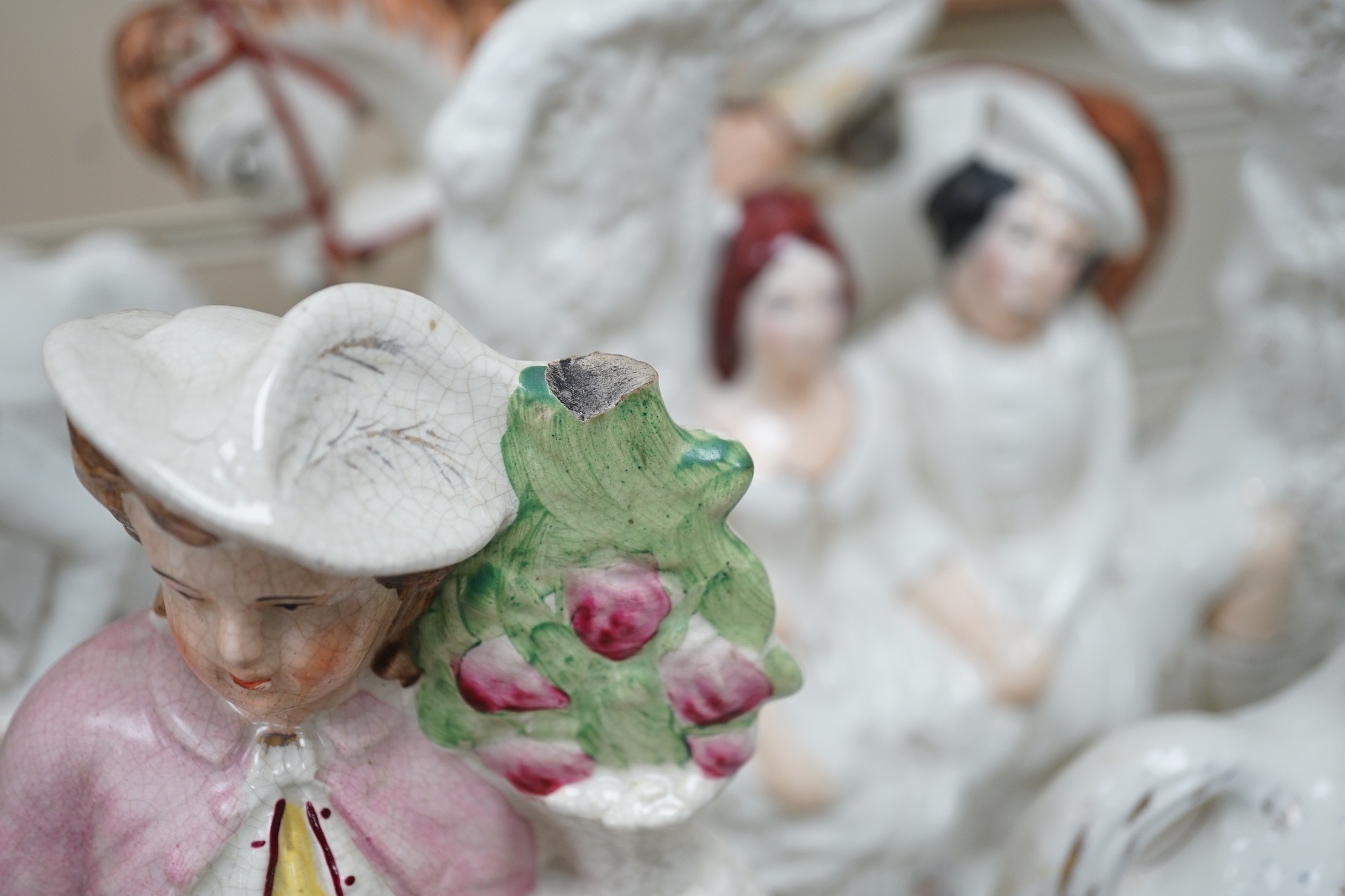 A collection of Victorian Staffordshire pottery flat-back figures and groups, tallest 36cm